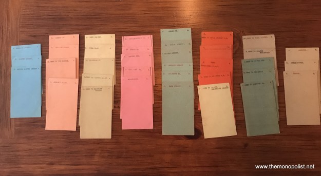 There are enough property cards for a complete game, plus some extras. My impression, from studying the cards, is that this owner had two boards. The first board had some customized property names, but many that were directly copied from the original Landlord's Game boards. The second, and more complete set has more customized street names, probably from the Wyomissing PA area (close to Reading), but still had some of the original names. Furthermore, the complete set has the property groups color coded, an important development in the history of the game. These are much like the cards Charles Darrow included with the earliest commercial versions of Monopoly he sold in 1933-34.