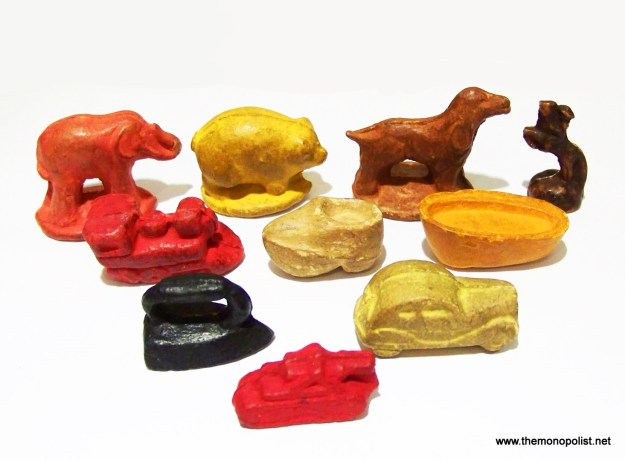 A set of 10 composite Monopoly tokens, in use from 1936 to 1945.